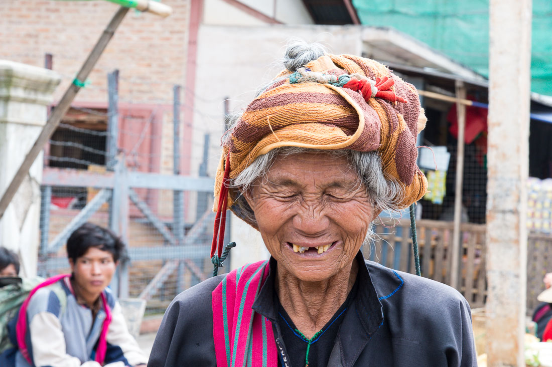 An old woman from the Pao people ethnich minority group, having good time at the market in Taunggyi the capital of the Shan State, Myanmar, Indochina, South East Asia.