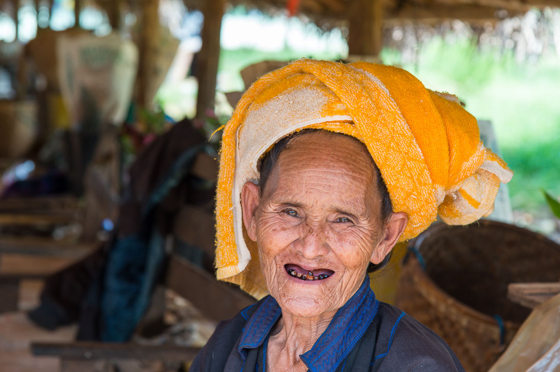 A very old woman from the Pao people ethnic minority group, selling her fresh produce at the entrance of Kakku. Shan State, Myanmar, Indochina, South East Asia.