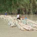 A barge made out of bamboo sticks for sale, sailing with the current down the Lemno river, Rakhine State, Myanmar, Indochina, South East Asia.