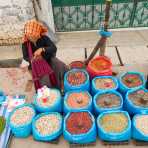 A woman selling dry seed, peanuts and other dry products. The market in Taunggyi, the capital of Shan State. Myanmar, Indochina, South East Asia.