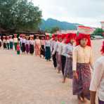 Women from the Pao people ethnic minorit group, bringing offer to the Buddhist monastery in Pattu village, Shan State, Myanmar, Indochina, South East Asia.