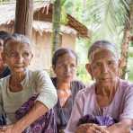 Four old women with the face full covered from spider web tattos, a mysterious and old tradition which was practiced until 60 years ago. There are 7 villages on the Lamro river with about 20 old women left with spider web tattoos on the face and all aged more than 65 years. Chin Village, Rakhine State, Myanmar, Indochina, South East Asia.