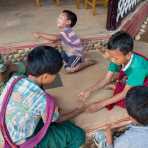 Children happily playing with pebbles during school break, Inle lake, Shan State, Mynamar, Indochina, South East Asia.