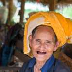 A very old woman from the Pao people ethnic minority group, selling her fresh produce at the entrance of Kakku. Shan State, Myanmar, Indochina, South East Asia.