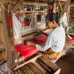 Weaving rare yarn from natural lotus fibers, to produce expensive scarves, Kyaing Kan Village, Inle Lake, Shan State, Myanmar, Indochina, South East Asia.