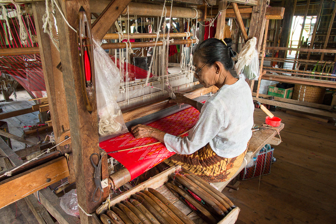 Weaving rare yarn from natural lotus fibers, to produce expensive scarves, Kyaing Kan Village, Inle Lake, Shan State, Myanmar, Indochina, South East Asia.