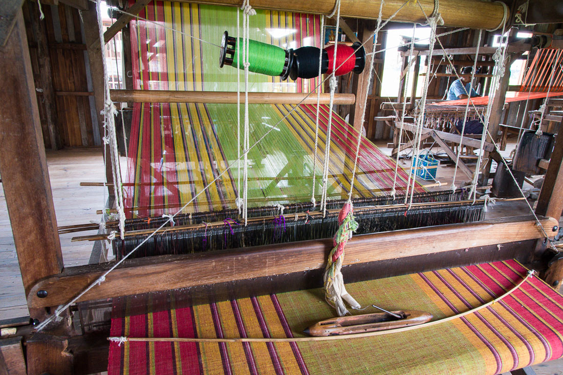 Weaving rare yarn from natural lotus fibers, to produce expensive scarves, Kyaing Kan Village, Inle Lake, Shan State, Myanmar, Indochina, South East Asia.