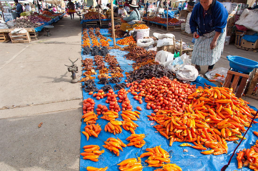 Tomatoes, red peppers and dry fruits at Chavin rural market, Peru, South America