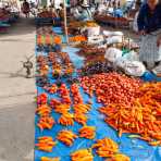 Tomatoes, red peppers and dry fruits at Chavin rural market, Peru, South America