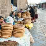 Women selling bred on the street of Cuzco, nearby the market, Peru, South America