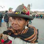 Woman in traditional costume selling little dolls, Cusco, Peru, South America