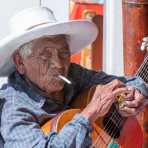 Old man playing guitar, Paracas, Peru, South America