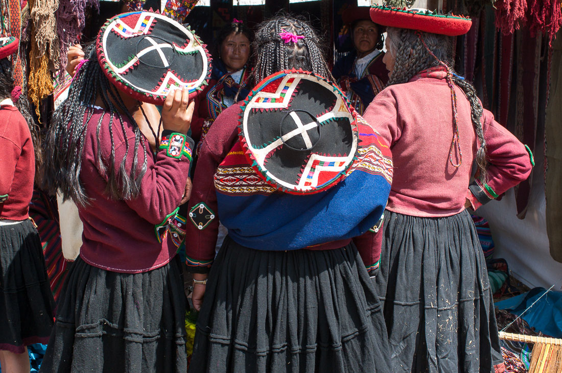 Colorful traditional costumes at the wool artisan fair in Chinchero, Sacred Valley, Peru, South America