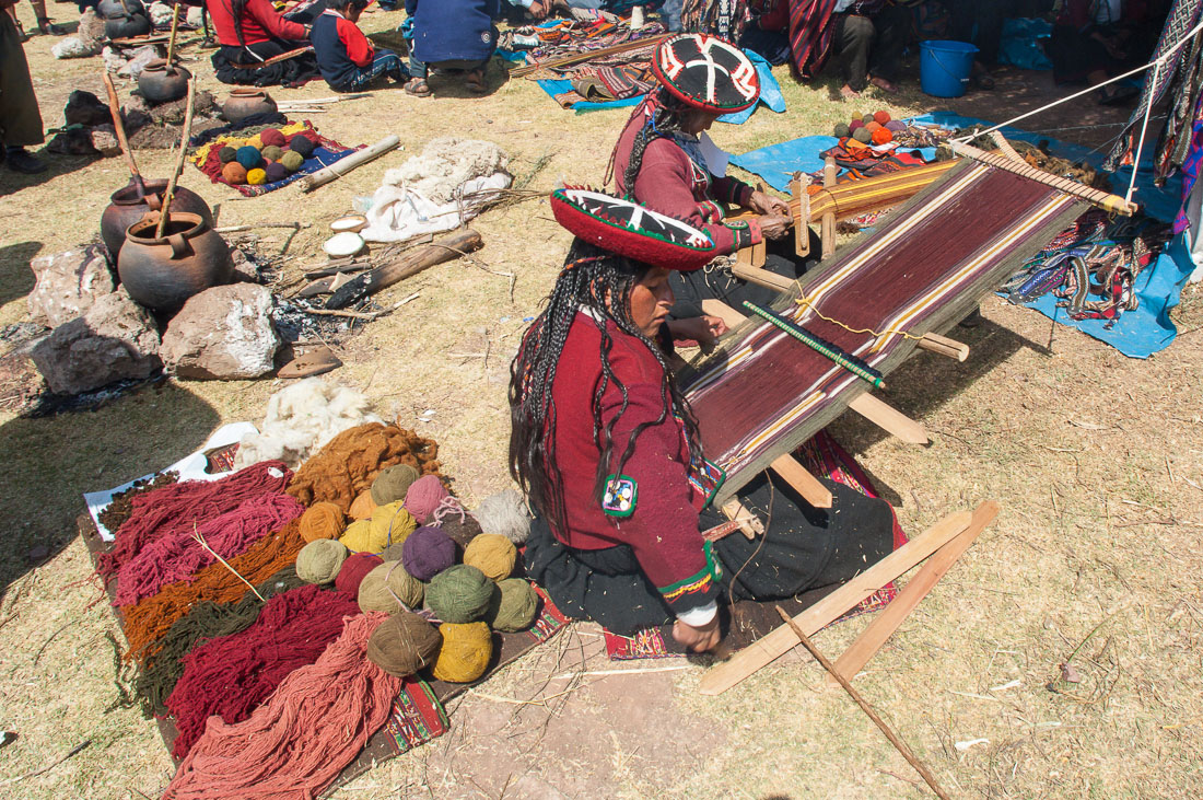 Women weaving at Cinchero wool artisan fair, Sacred Valley, Peru, South America