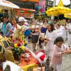 Followers of the Bang New Shrine taking part in a street procession during the annual Chinese vegetarian festival, with a custom made vehicle carrying the statue of a turtle sprying sacred water. Phuket, Kingdom of Thailand, Indochina, South East Asia