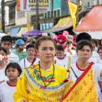 Female psychic medium follower of the Bang New Shrine with a long and thick needle pierced through her cheek, taking part in a street procession during the Chinese annual vegetarian festival. Phuket, Kingdom of Thailand, Indochina, South East Asia