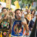 Psychic medium follower of the Bang New Shrine, with four sickles pierced through his cheeck, taking part in a street procession during the annual Chinese vegetarian festival. Phuket, Kingdom of Thailand, Indochina, South East Asia