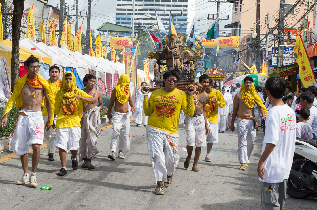 Followers of the Bang New Shrine carrying the statue of a deity, taking part in a street procession during the annual Chinese vegetarian festival. Phuket, Kingdom of Thailand, Indochina, South East Asia