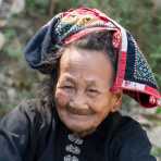 An old woman from the White Tai people ethnic minority, wearing traditional costume, Phú Yên province. Viet Nam, Indochina, South East Asia.