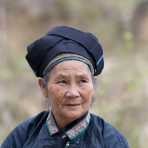 An old woman from the Nung people ethnic minority, wearing traditional costume, Ha Giang province. Viet Nam, Indochina, South East Asia.