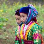Young girls from the Black Hmong people ethnic minority, wearing traditional costume, Ha Giang province. Viet Nam, Indochina, South East Asia.