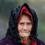 A very old woman from the Black Hmong people ethnic minority, wearing traditional costume, countryside Ha Giang province. Viet Nam, Indochina, South East Asia.