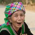 Old woman from the Black Hmong people ethnic minority, showing her blackened teeth, wearing traditional costume, countryside Lai Chau province. Viet Nam, Indochina, South East Asia.