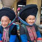 Women from the Dao people ethnic minority group, wearing turban hat and traditional clothes. Lung Phin market, Ha Gang province, Viet Nam, Indonesia, South East Asia