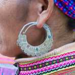 Earring of a woman from the Flower Hmong people ethnic minority group, wearing traditional clothes. Can Cau market, Lao Cai province, Viet Nam, Indonesia, South East Asia