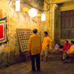 People in traditional costumes playing chess during the full moon festivity. Hoi An, Quang Nam province. Viet Nam, Indochina, South east Asia.