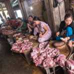 Women selling pork meat at Hue market, Thua Thien-Hue province. Viet Nam, Indochina, South East Asia.