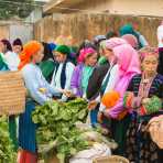 Women from the Balck Hmong people ethnic minority group, buying at busy market in Meo Vac, Ha Giang Province, Viet Nam, Indochina, South East Asia
