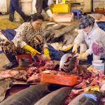 Two women cleaning very large fishes at the rich wholesale fish market in Da Nang, Viet Nam, Indochina, South East Asia