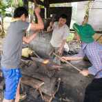 A family of blacksmith at work, producing kives, hatchets, and all sort of cutting devices. Viet Nam, Indochina, South East Asia.