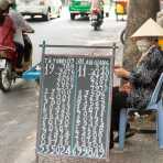 A woman selling lottery tickets in Ho Chi Minh City (Saigon). Viet Nam, Indochina, South East Asia.