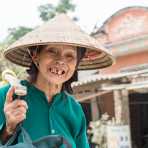 Old vietnamese woman on her way home, proudly showing her smile. Lang Son Province, Viet Nam, Indochina, South East Asia.