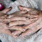 The hard working hands of an old woman at the market in Hoi An, Quang Nam Province, Viet Nam, Indochina, South East Asia.