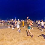 Healthy Vietnamese women practicing aerobic exercise just before sunrise, on the banks of Han River. Da Nang Viet Nam, Indochina, South East Asia. Nikon D4, 20mm f2.8