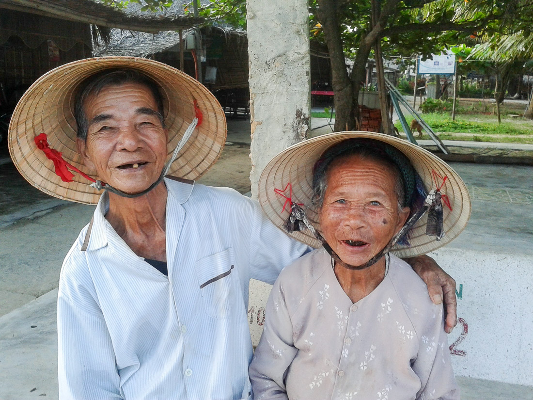 Together forever. This lovely old couple have been married for more than 60 years, both in their middle eighties, they look very happy. Hoi An, Quang Nam Province, Viet Nam, Indochina, South East Asia. Samsung smartphone.